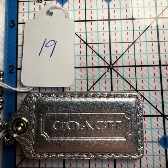 Coach Accessories - Coach Metallic Silver Keychain